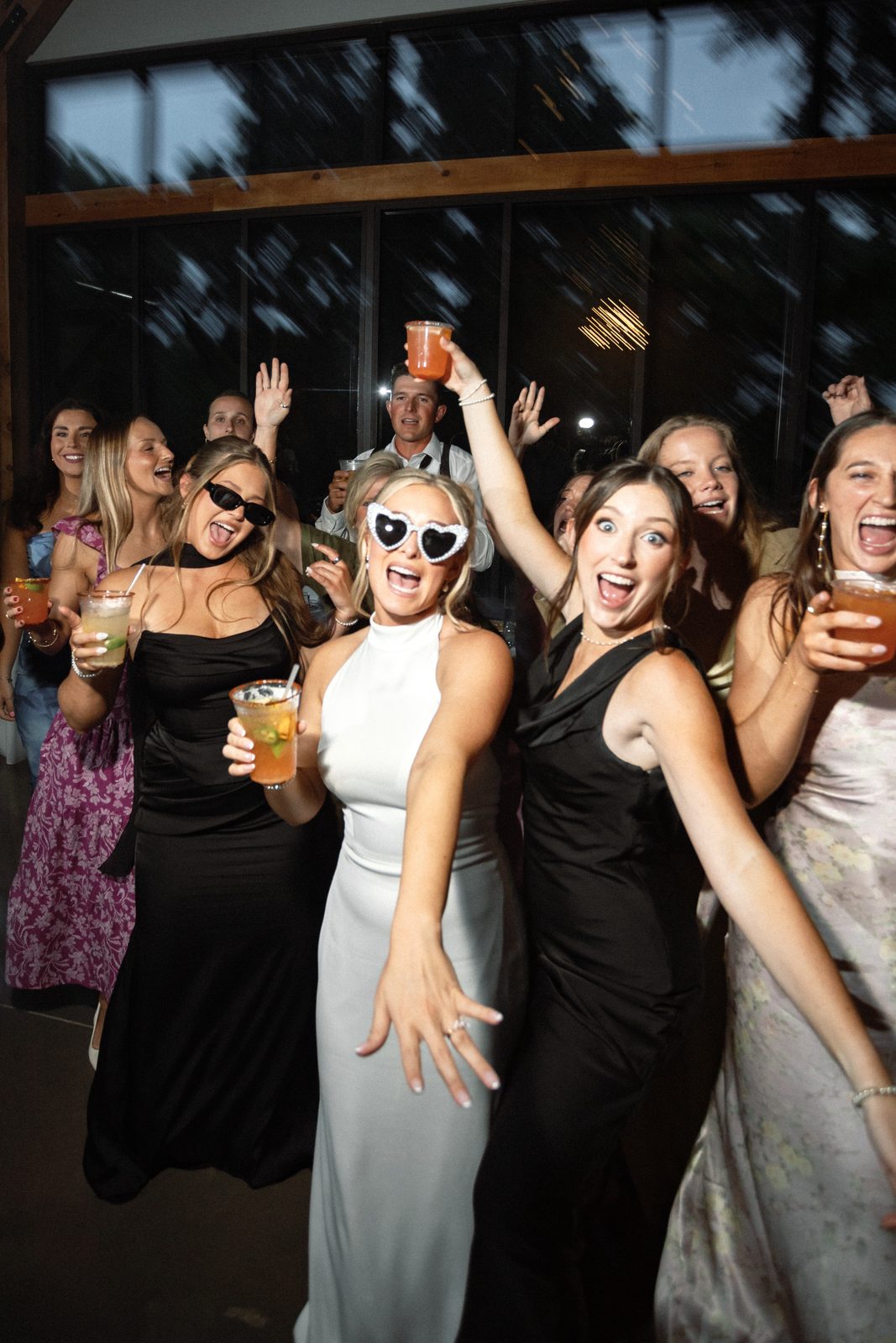 Candid reception moment on the dance floor with the bride and her friends
